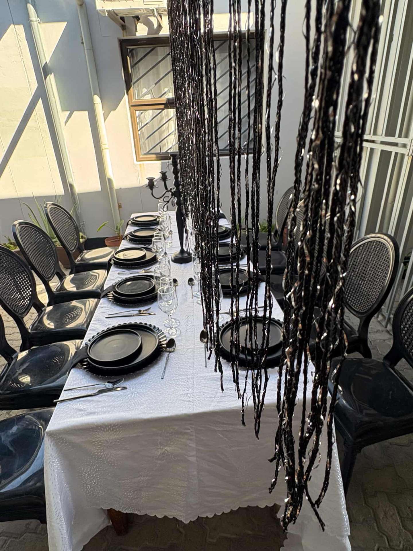 Long dining table with candelabra centrepiece